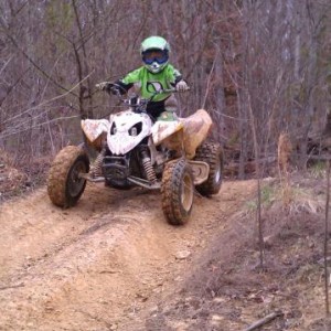 My younger so Seth on his Polaris outlaw 90