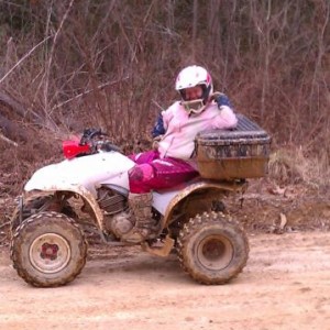 my wife taking a break during our trail ride on her 300 ex