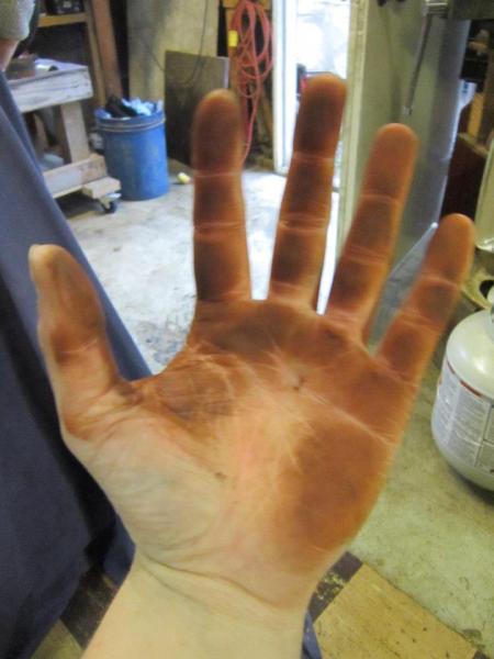 my hand after I got done sanding the expansion chamber.