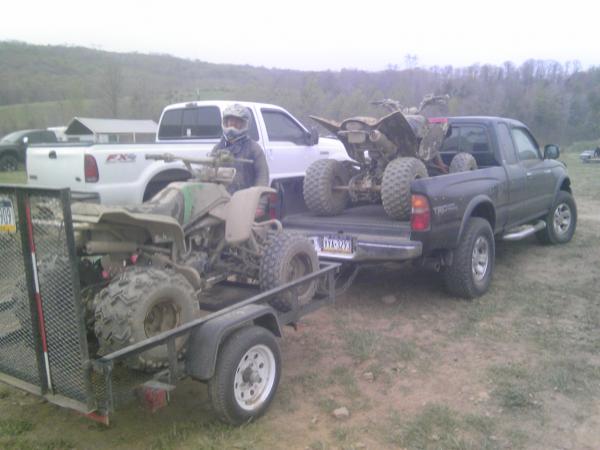my quad on trailer and friend's raptor on his truck