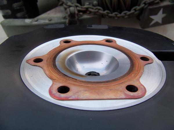 The cut step fits flush with the copper head gasket.
