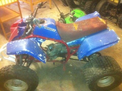 this is how it looked when i picked it up the faded spray painted hood and tank cover r now the ones on the red and gray bike